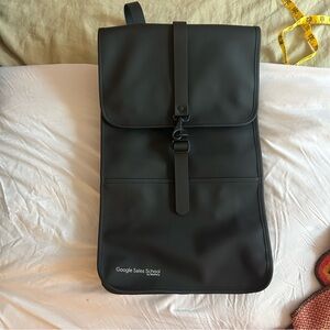 RAINS NWT Black Backpack with Google branding